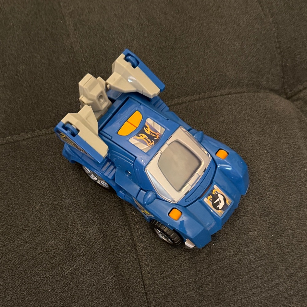 Switch and Go Blue Transforming Race Car to Triceratops